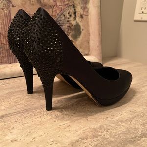Aldo black platform heels with decorative back. Black rhinestones on the heel.
